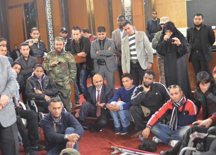 Damaged GNC building vacated by squatting amputees – finally